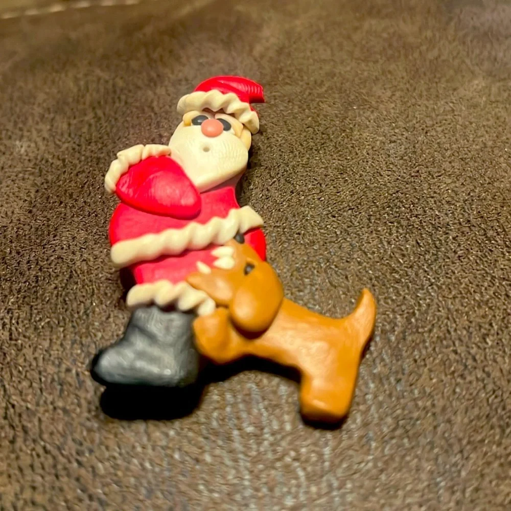 Vintage santa with dog biting brooch
